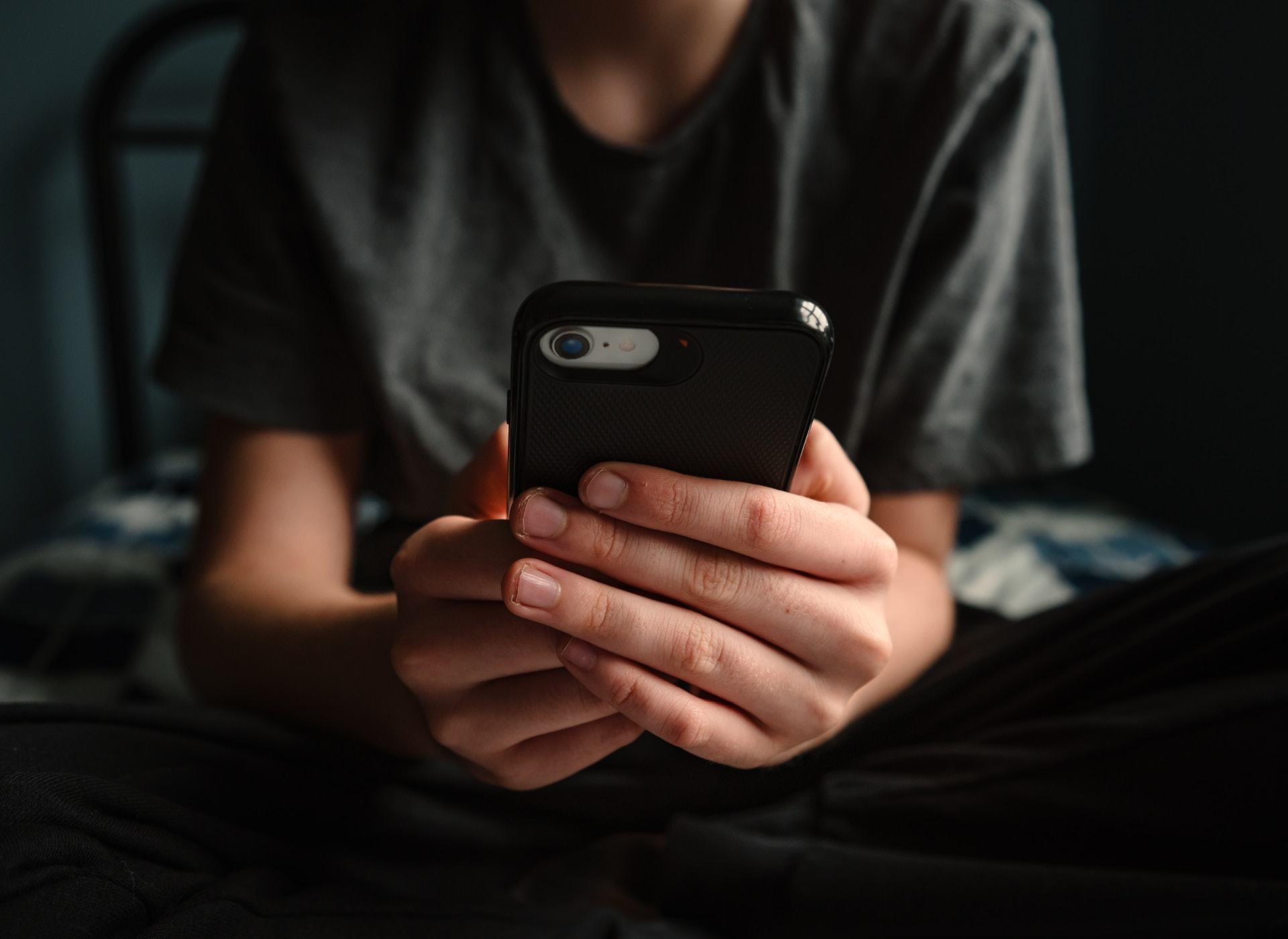 image of teen on a cell phone