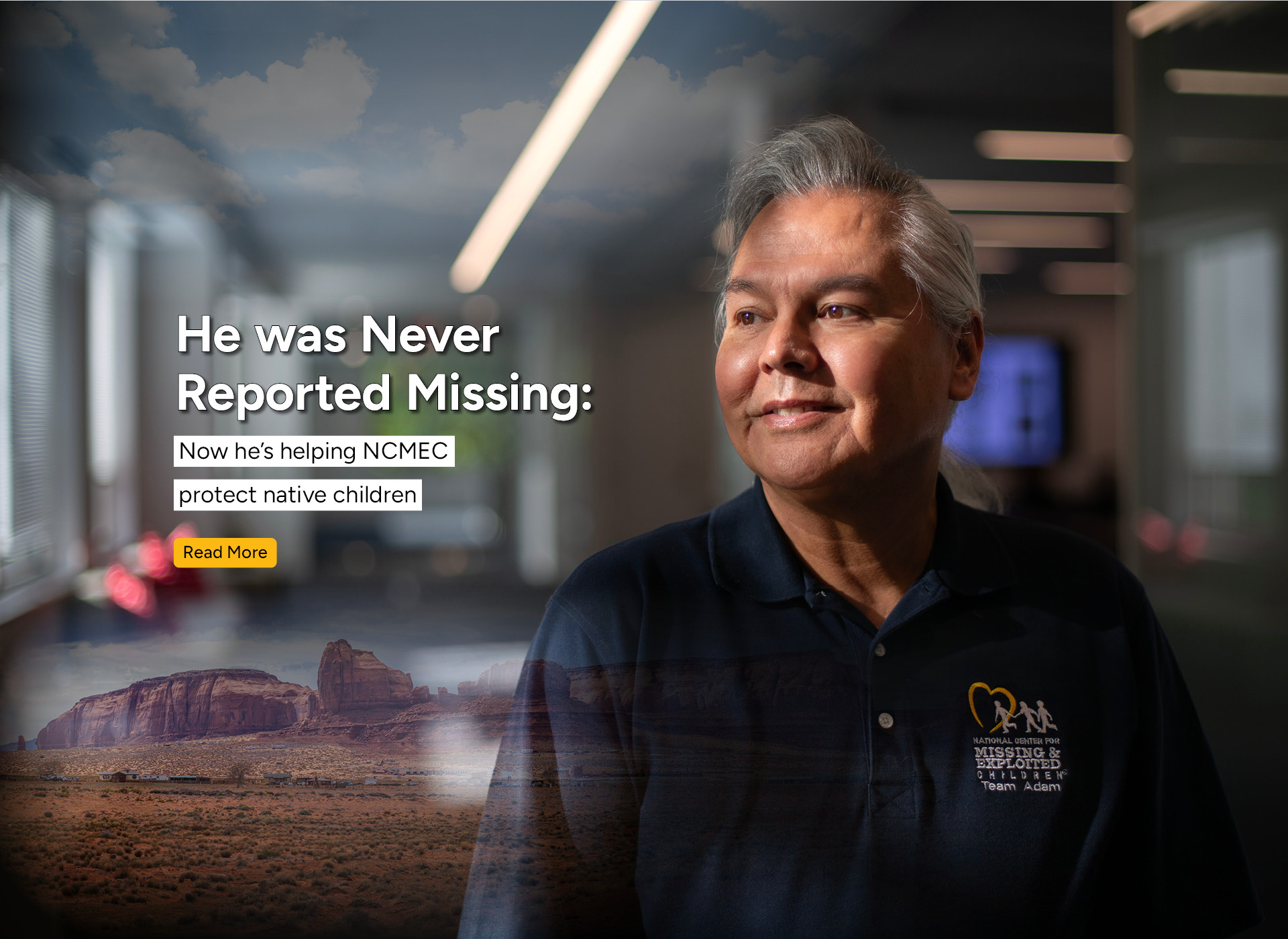 photo of native american man with white hair; background of western mountains